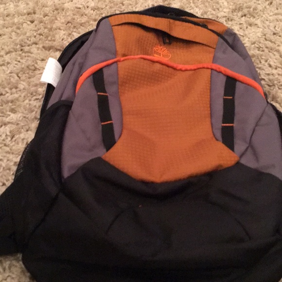 grey and orange backpack